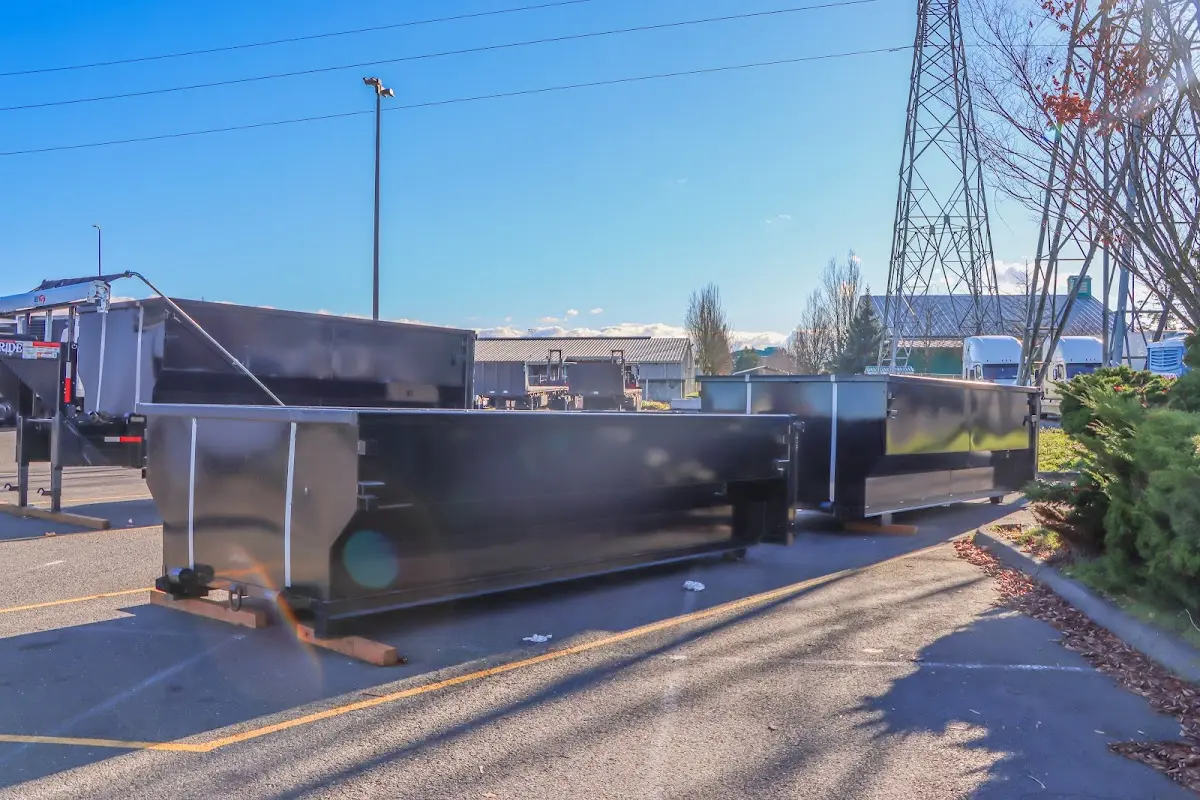 Roll-off dumpster ready for waste disposal at job site for Demolition Dumpster Rental in Caldwell